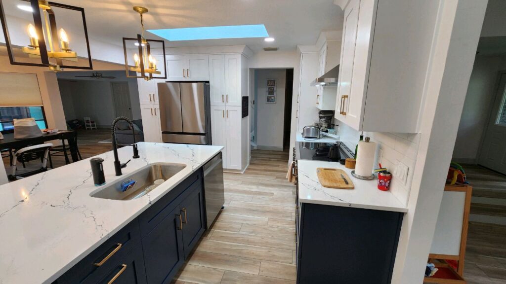 Team Farrell kitchen with white cabinets and quartz tops
